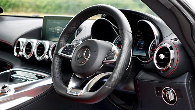 Close up image of mercedez benz steering wheel